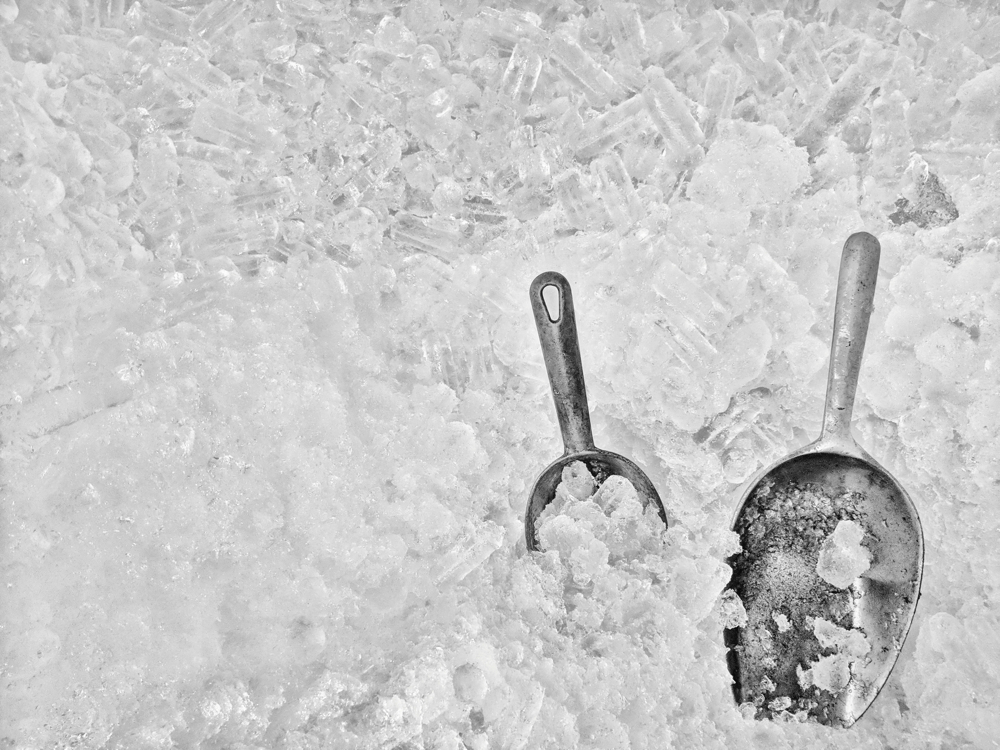 Metal ice scoop in ice bucket