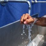 surgeon washing hands with soap and water