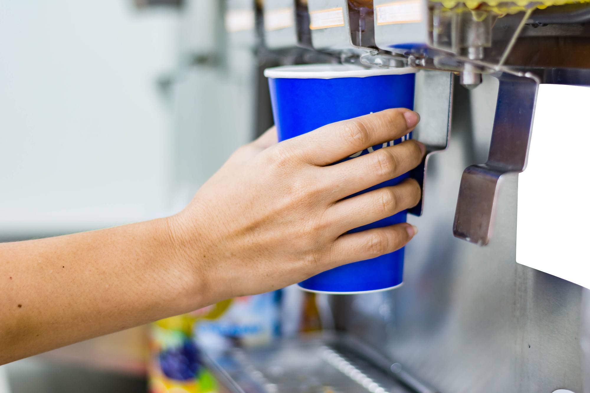 hand of woman serving beverage of cooler