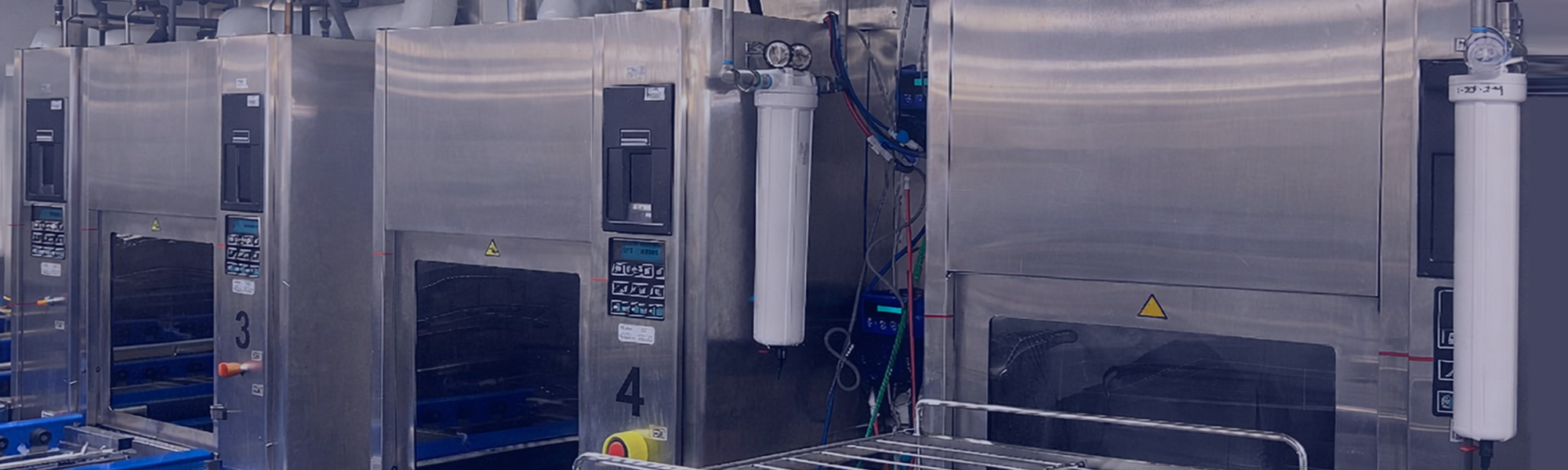 Stainless steel sterile processing washer-disinfectors in a healthcare facility, highlighting critical water contact points where ultrafiltration helps control bacteria and endotoxins in ST108-aligned environments